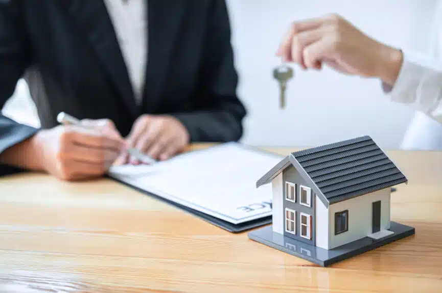 Person signing a document to get an insured mortgage