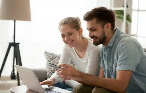 Young couple learning how to qualify for a mortgage in Ontario.